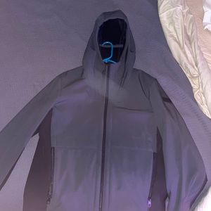 Tumi: large faux black fuir lined jacket.